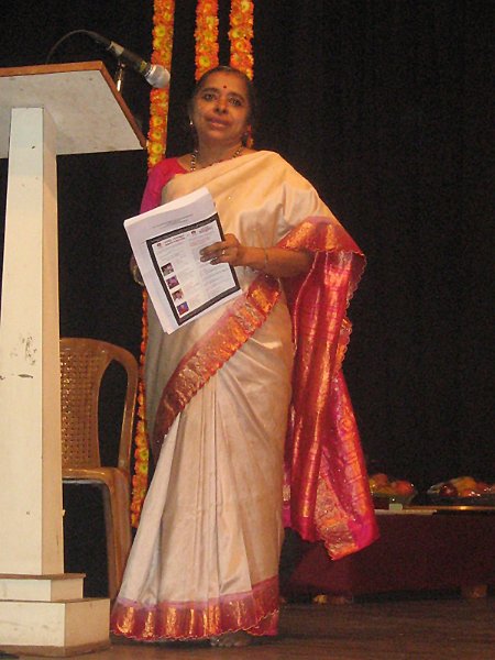 Vocalist Dr. R.N. Srilatha felicitating the senior vidwan receiving awards.jpg